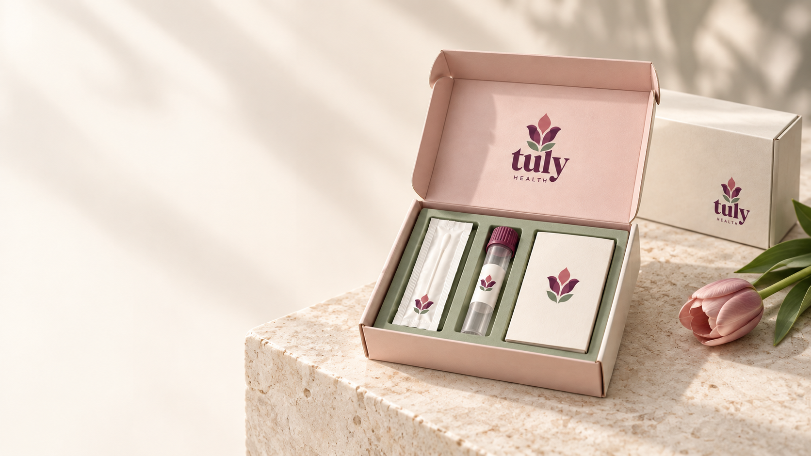 An open Tuly Health collection-kit concept with a sealed swab packet, collection tube, and guide card.